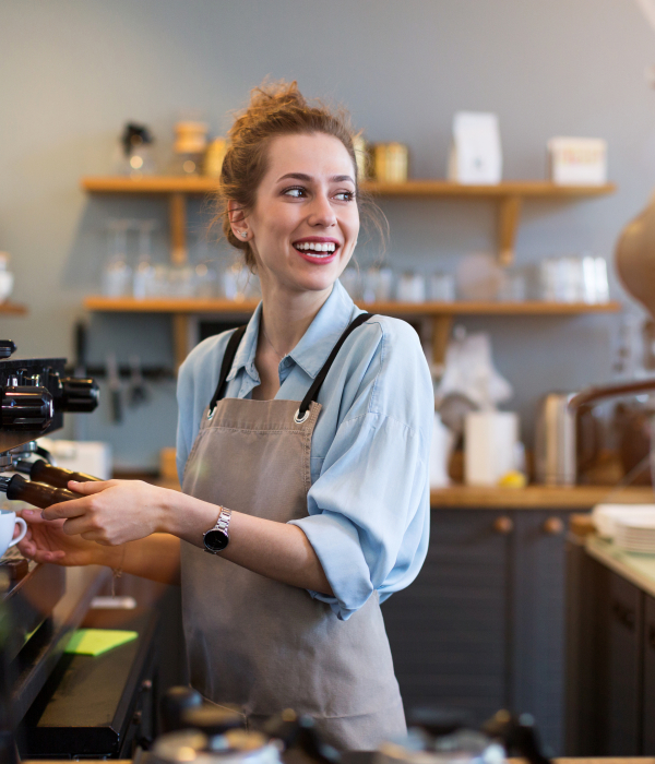 Barista vid kaffemaskin